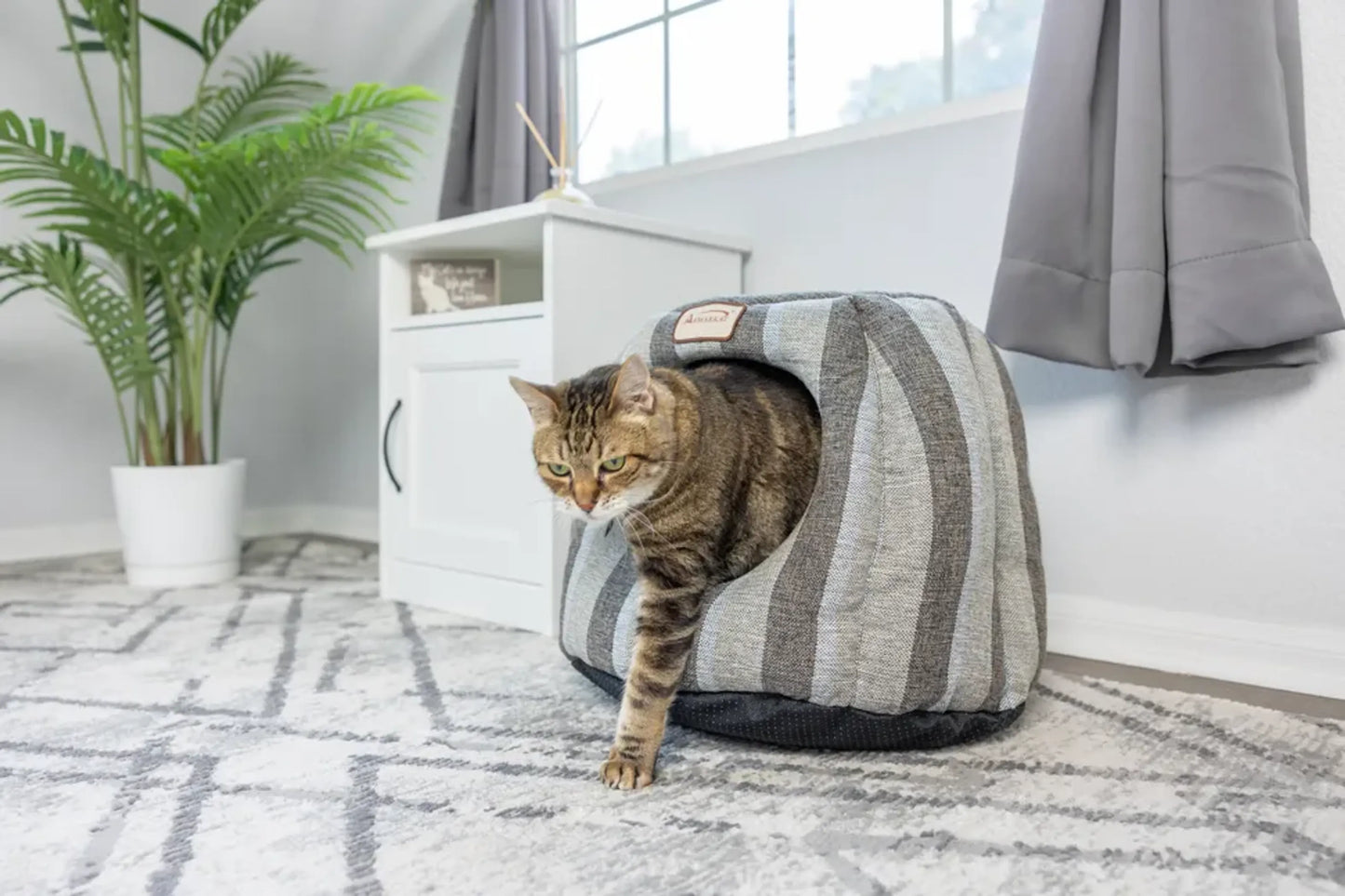 Armarkat Cat Cave Shape Bed with Anti-slip Base and Cushion Mat, 20x20x14 inches, in a cozy home setting.